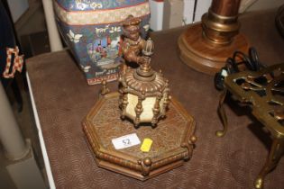 A brass figural decorated inkwell