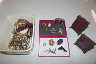 A box containing various costume jewellery includi