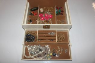 A jewellery box and contents to include rolled gol