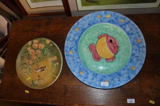 A large fish platter and a Bosun's plaque