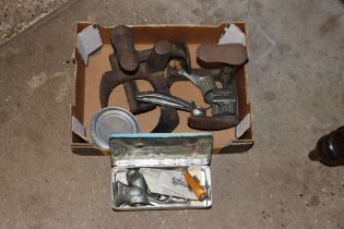 A box containing a Spong mincer, three shoe lasts