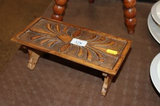 A small carved folding stand