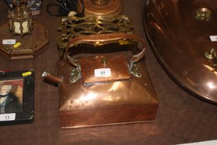 An Arts & Crafts type copper kettle and a copper a