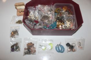 A box containing costume jewellery, ear-rings, bro
