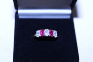 A silver gilt, cubic zirconia and ruby coloured st