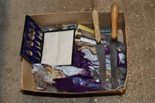 A box of various cutlery