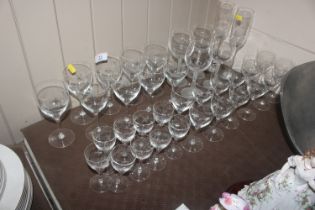 A collection of etched and other drinking glasses