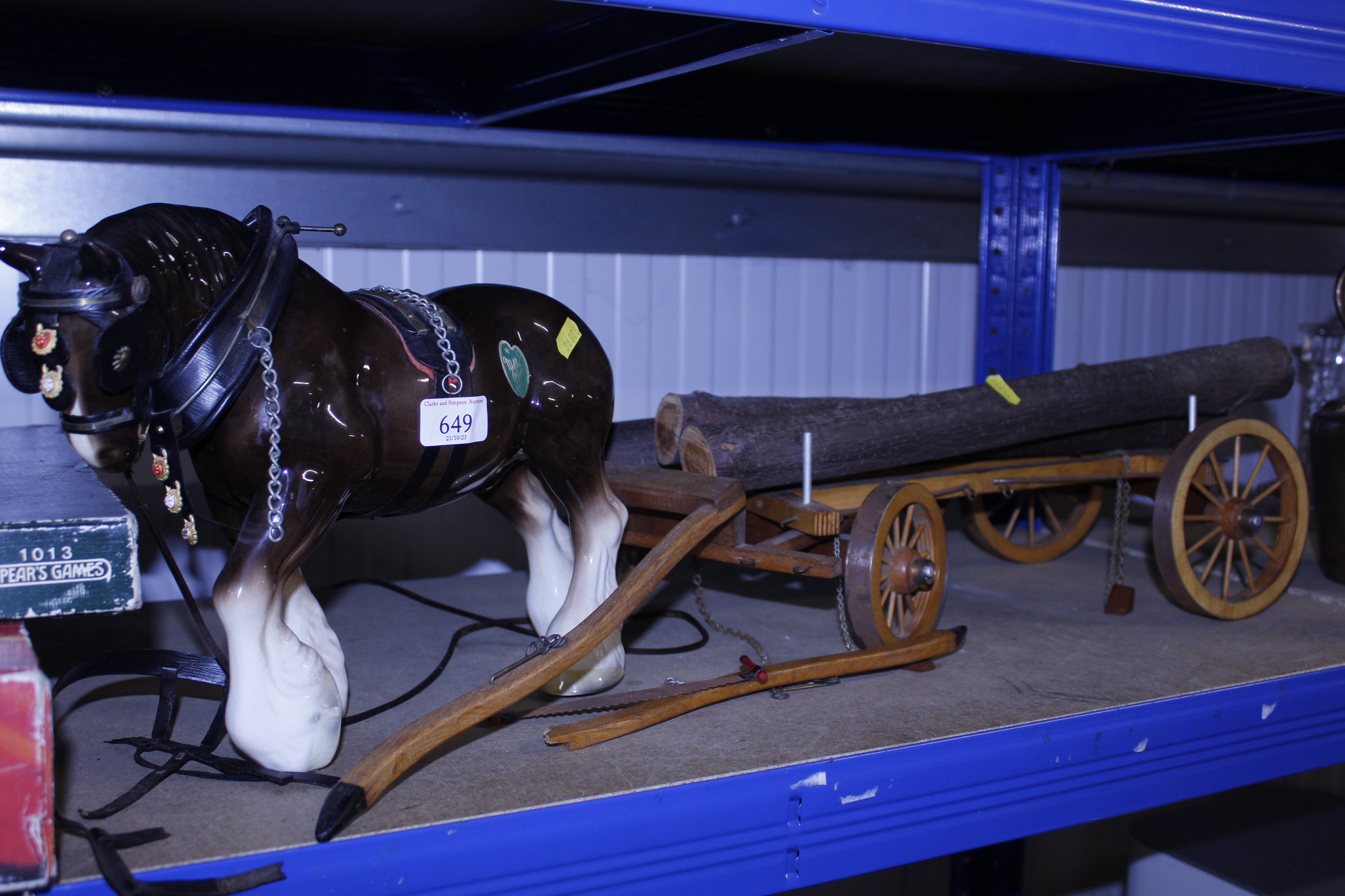 A Melba ware pottery horse and log hauling cart