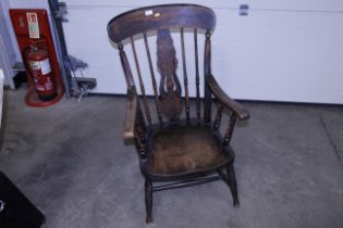 A 19th Century elm slat back elbow chair