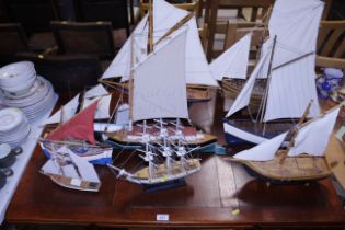 A collection of various model yachts and sailing b