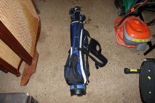 A golf bag containing clubs