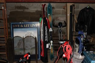 Two pairs of skis and poles