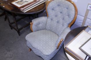 A Victorian walnut framed button back armchair