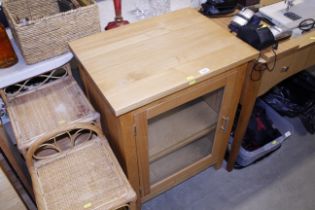 A modem lightwood side cabinet and two bamboo and