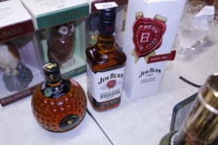 A boxed bottle of Jim Beam bourbon whiskey and a b