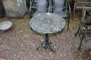 A cast metal garden table