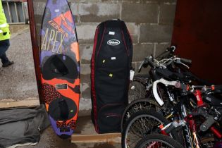 Various water board and sports storage bags