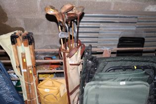 A canvas and leather golf bag and contents of vint