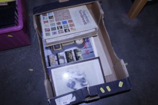 A box of various prints and books including an Ame