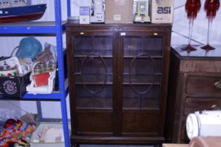 A 1930's oak china display cabinet