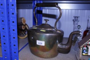 An antique copper kettle