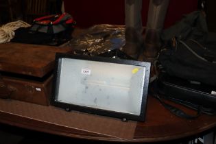 A Power outdoor flood light with mounting brackets