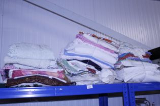 A quantity of various bundles of mixed linen, towe