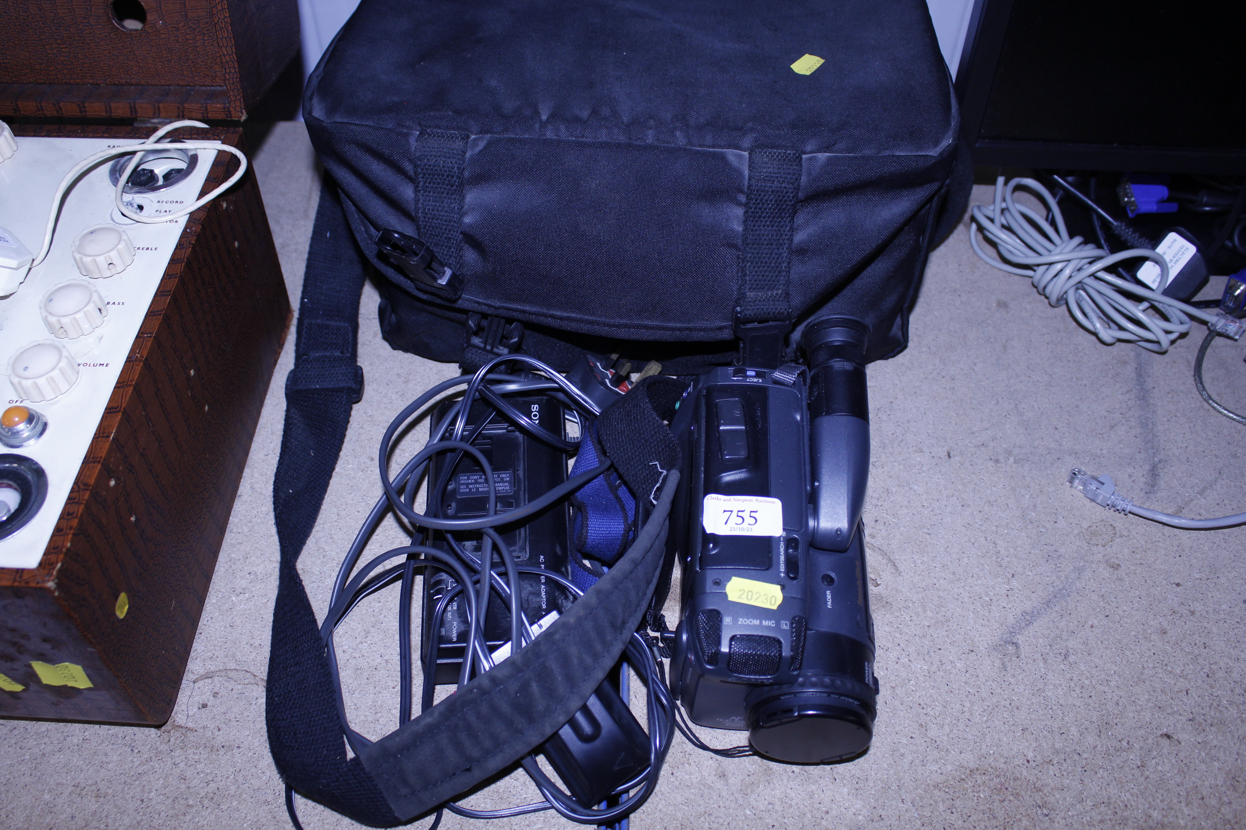 A Sony Handycam with accessories and carrying bag