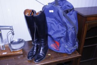 A pair of riding boots and a Cottage Craft bag