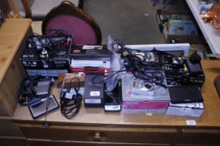 A collection of various cameras, mobile phones, sa