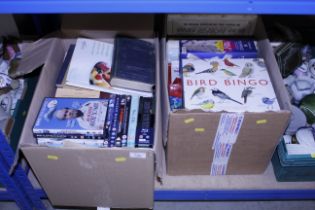 Two boxes containing various DVD's, books, board g