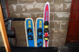 A pair of Hotline water skis and one other