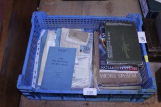 A collection of military photography books and a e