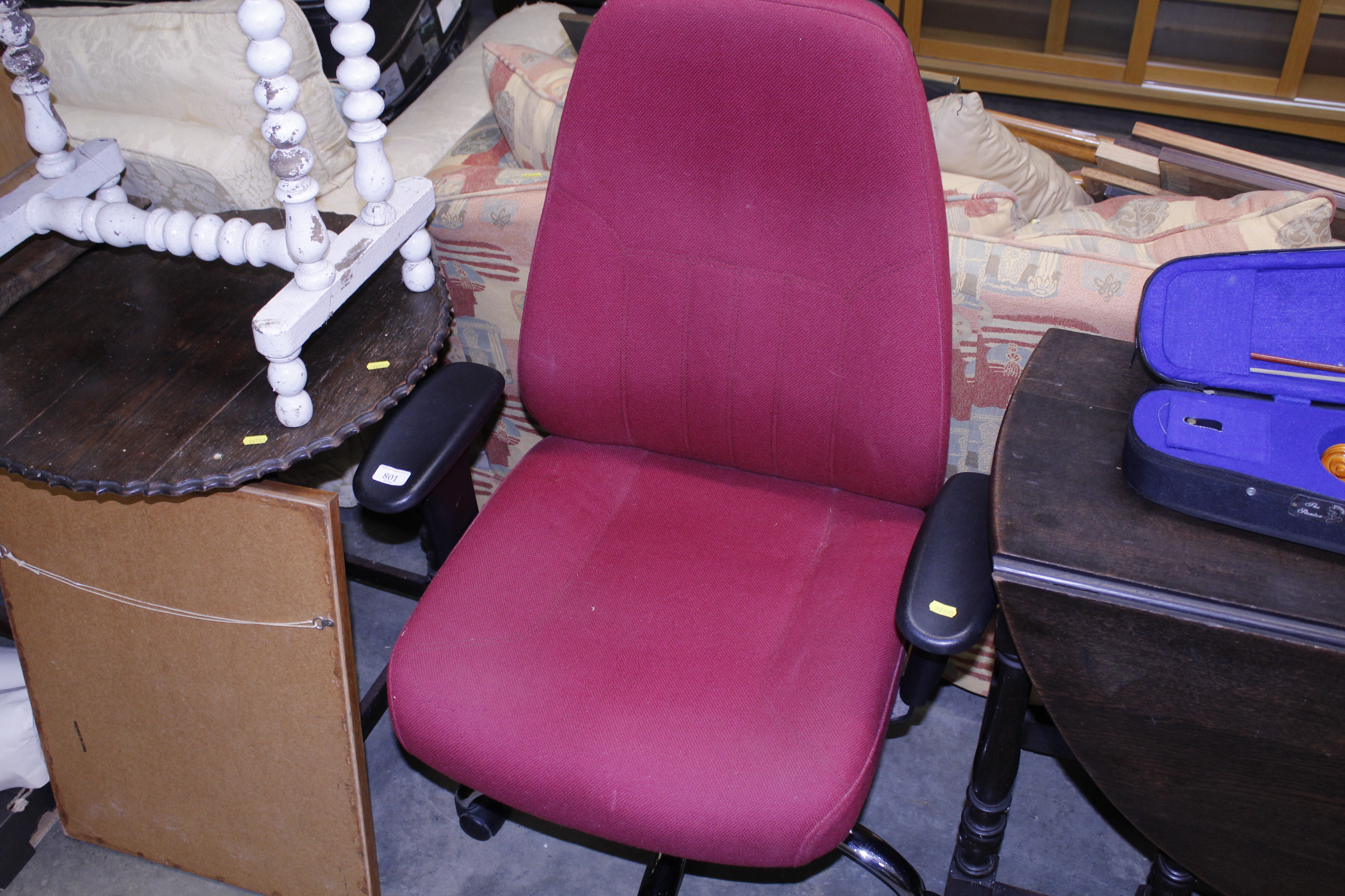 A revolving office desk chair