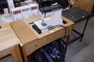 A Futura sewing machine in table stand