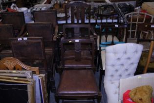 A 1930's oak elbow chair and a pair of similar per