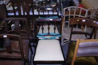 A pair of mahogany rail back dining chairs