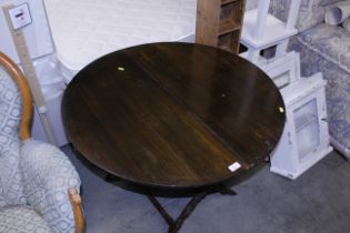 An antique folding coaching table