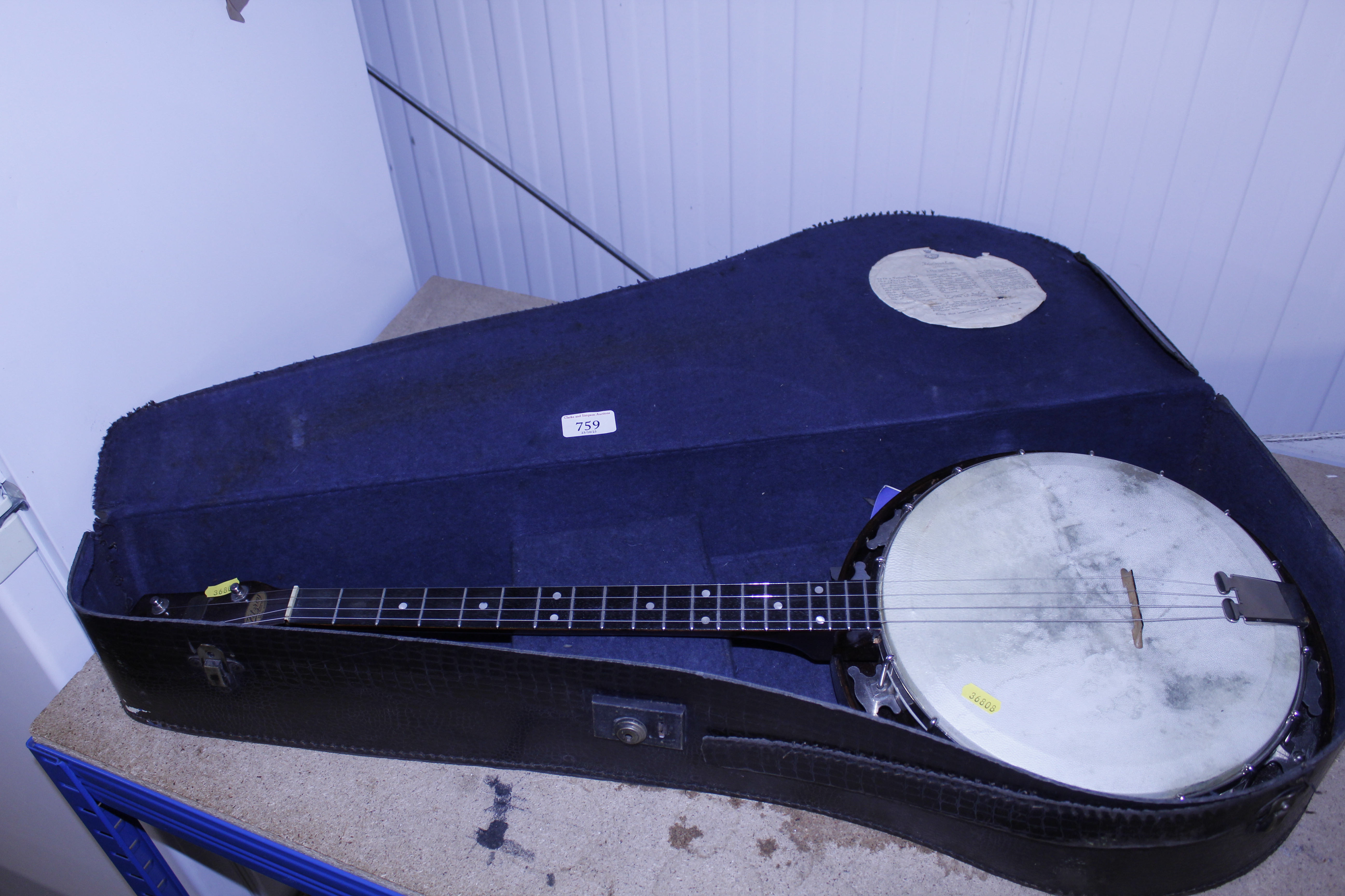 A Fitzroy banjo in case
