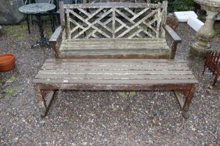 A slatted wooden garden bench