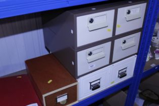 Two sets of metal card index filing drawers; and a