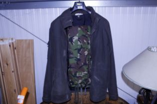 A Quicksilver wax coat and a pair of camouflage tr