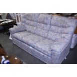 A floral upholstered three seater settee