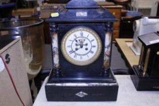 A large Victorian marble mantel clock with visual