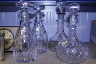A pair of Victorian glass decanters and two others