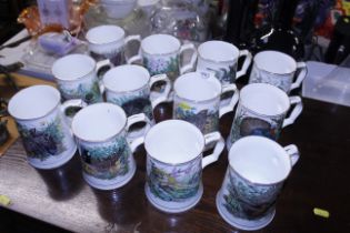 A set of twelve Hammersley bone china bird mugs decorated by M J Pledger