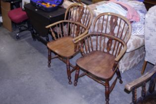 Two elm seated Windsor elbow chairs