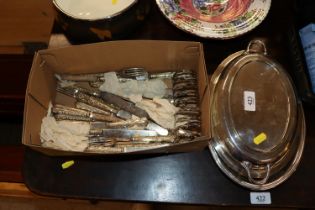 A box of silver handled cutlery; toast rack and si