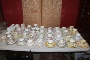 A large collection of various trios, cups and sauc