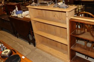 A pine three tier open fronted bookcase